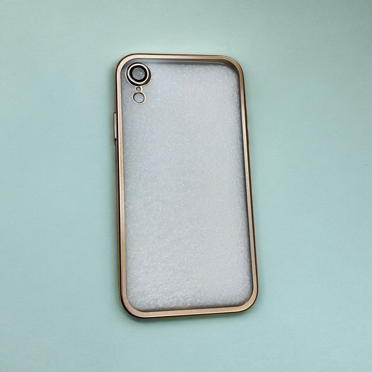 The Zivikart Elegant Electroplated Case with Camera Protection for Apple iPhone, featuring a metallic gold frame and a white frosted back cover, is placed on a light blue surface. The durable material of the Zivikart case offers excellent camera protection, with the lens and flash clearly visible on the top left corner of the back.